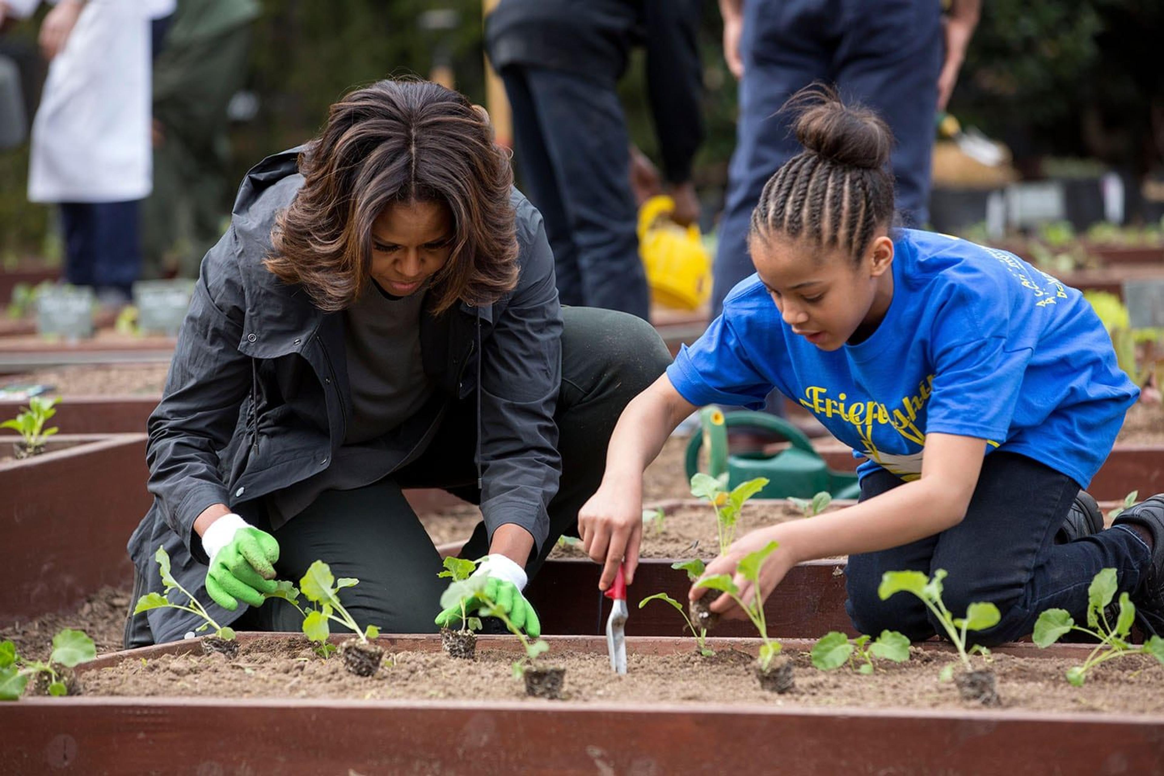 5196 scr 2014 michelle obama and student spring planting fli